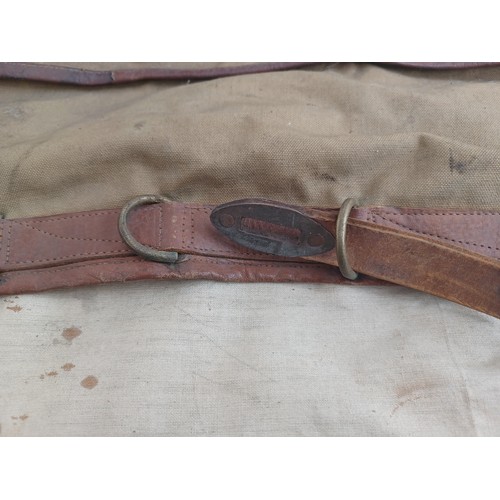 702C - A mid 20th century canvas and leather military bag marked K.R. RANS N.STAFFS REG'T M.E.L.F. FAYID EG... 