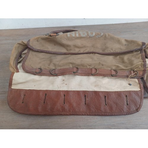 702C - A mid 20th century canvas and leather military bag marked K.R. RANS N.STAFFS REG'T M.E.L.F. FAYID EG... 