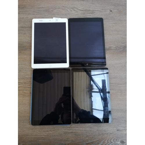 910 - Four Apple iPad tablets, three A1474 and one A1475