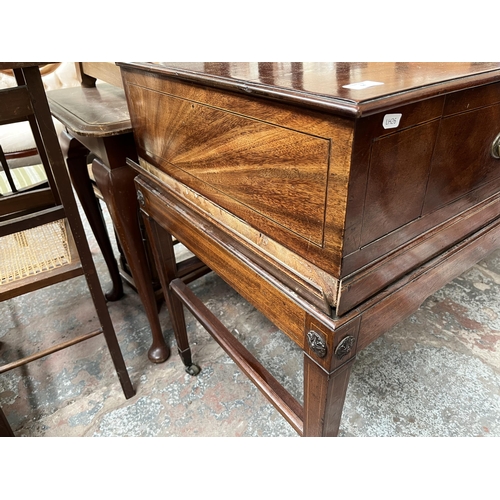 65 - A Regency inlaid mahogany sideboard with two drawers, tapered supports and castors
