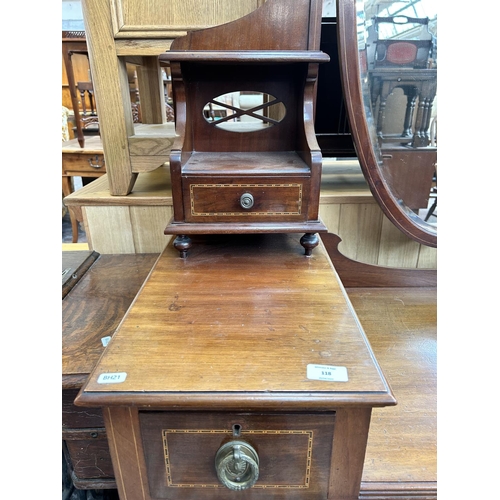 126 - An Edwardian inlaid mahogany dressing table with six drawers, shield shaped mirror and tapering supp... 