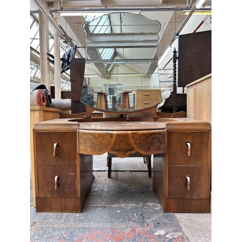 189 - An Art Deco style walnut dressing table with five drawers and upper mirror