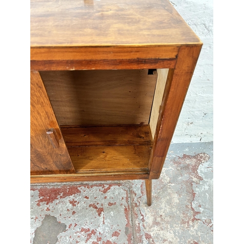 225 - A mid 20th century plywood two door cabinet with splayed supports - approx. 76cm high x 77cm wide x ... 