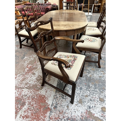 245 - A Georgian mahogany D end extending dining table and eight matching chairs