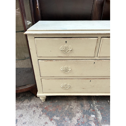 22 - A late Victorian painted pine chest of two short over two long drawers