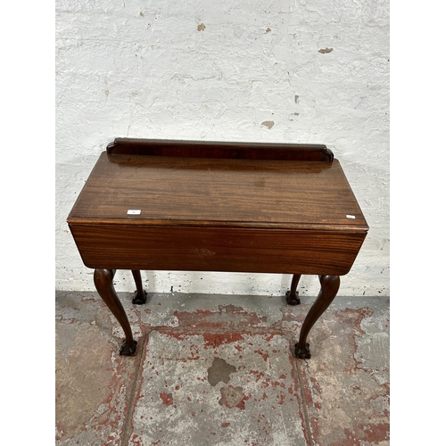 23 - A Georgian style mahogany drop leaf cutlery table with ball and claw supports