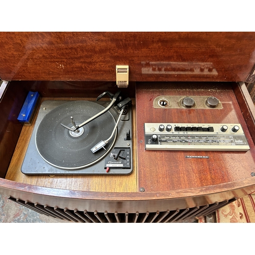 27 - A Beau-Decca walnut radiogram containing Tandberg Portable 41 radio and Garrard 3000 four speed auto... 