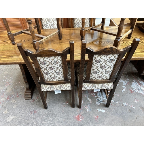 32 - A Webber Furniture oak rectangular dining table and six tapestry upholstered dining chairs