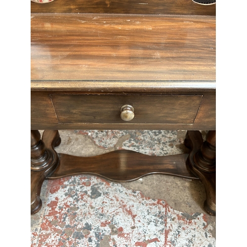34 - A Victorian mahogany wash stand with galleried back and single drawer