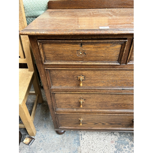 41 - A 1930s oak chest of two short over three long drawers