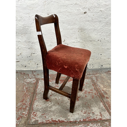 52 - A mid 20th century beech and red fabric upholstered child's chair