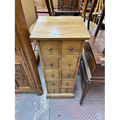 62 - A modern oak CD cabinet with ten drawers