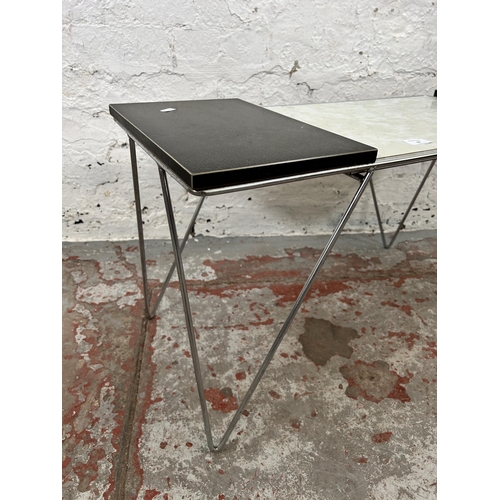 68 - A 1960s black and white formica rectangular coffee table on tubular metal supports