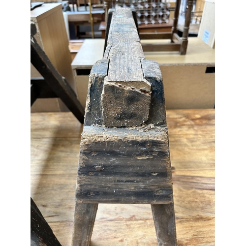 74 - Two early 20th century rustic pine carpenter's trestle stands