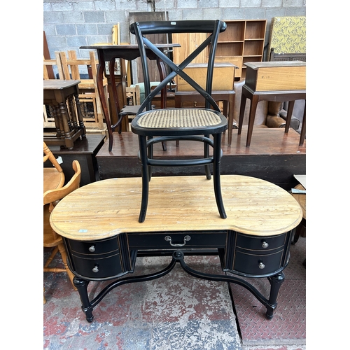 88 - A French Empire style ebonised and oak writing desk with five drawers and rattan seated chair