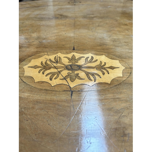90 - A Victorian inlaid walnut oval loo table on quatrefoil base