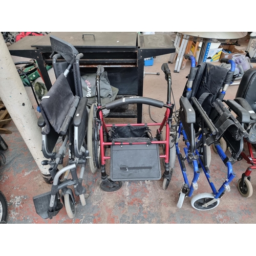 877 - Three mobility items, one Sunrise medical folding wheelchair, one Drive four wheeled walking frame a... 