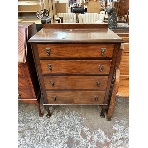 103 - An Edwardian mahogany chest of four drawers with cabriole supports