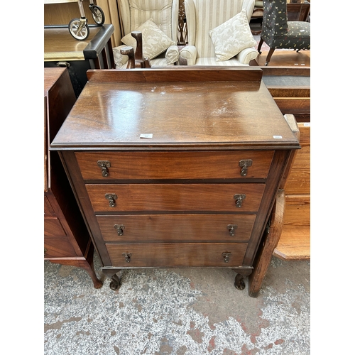 103 - An Edwardian mahogany chest of four drawers with cabriole supports