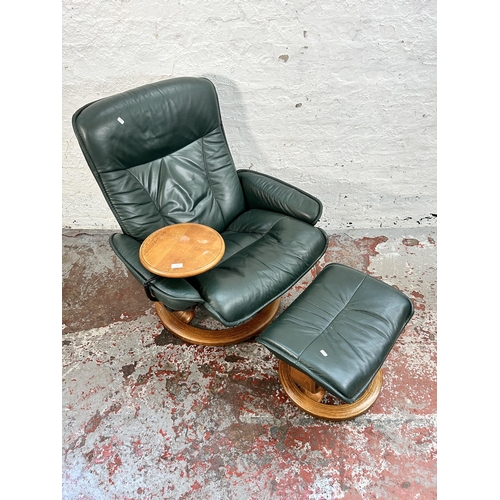 108 - An Ekornes Stressless green leather and bentwood reclining armchair with revolving side table and fo... 