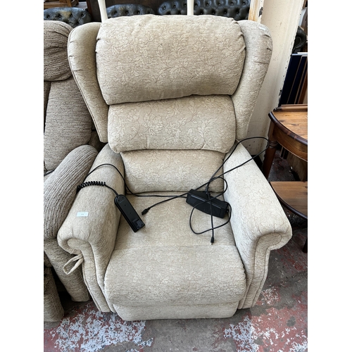 111 - A modern fabric upholstered electric reclining armchair with remote and power supply