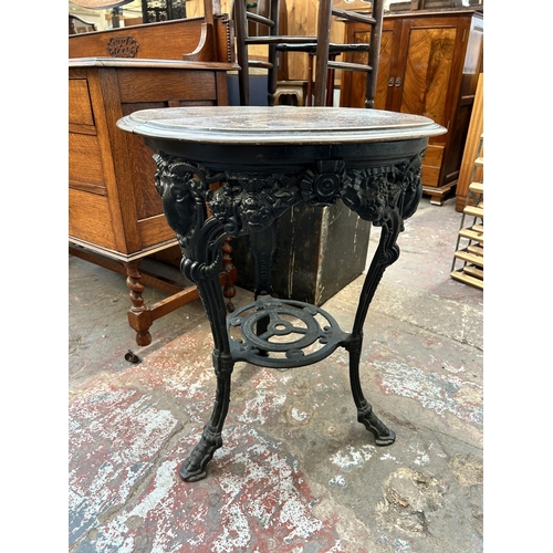 115 - A Victorian cast iron and mahogany circular pub table
