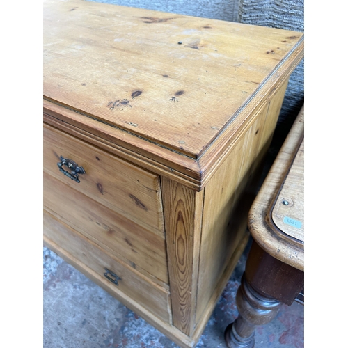 121 - A Victorian pine chest of two short over two long drawers on turned supports and castors