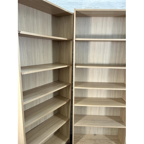 136 - Three IKEA Billy oak effect bookcases - approx. 202cm high