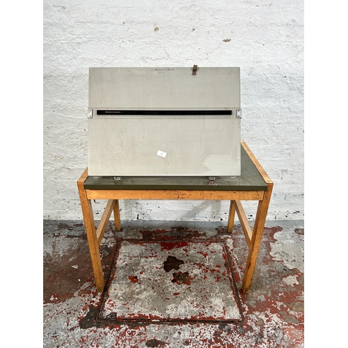 144 - A 1970s British Thornton beech and olive green formica drawing table