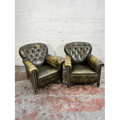 145 - A pair of early 20th century green leather club armchairs with mahogany supports