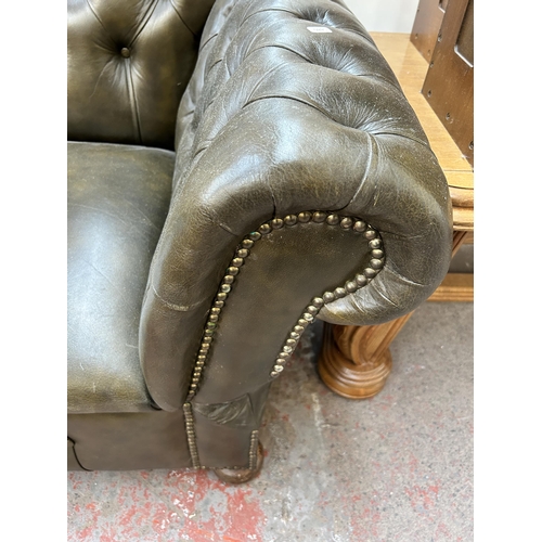 146 - A 1930s green leather Chesterfield drop arm sofa