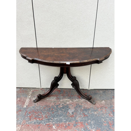 149 - A Victorian walnut serpentine wall mountable console table with scrolled supports