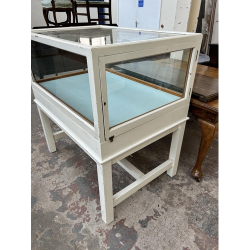 155 - A mid 20th century white painted pine museum display cabinet with single glazed door - approx. 115cm... 