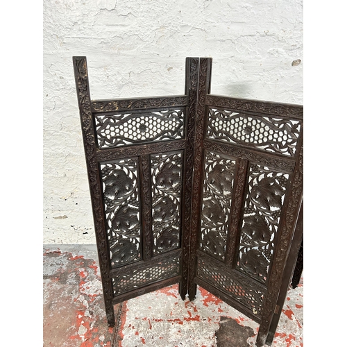 164 - A late 19th/early 20th century Anglo Indian carved hardwood four section folding screen - approx. 81... 