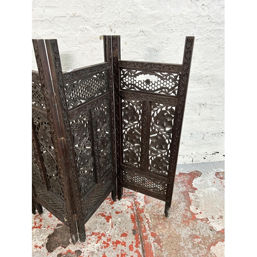 164 - A late 19th/early 20th century Anglo Indian carved hardwood four section folding screen - approx. 81... 