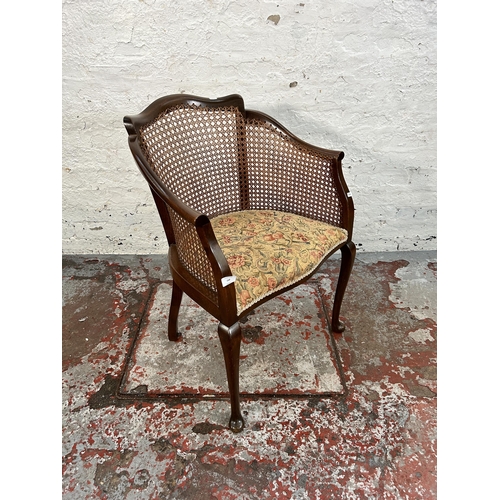 168 - An early 20th century beech, cane and tapestry upholstered bergere armchair