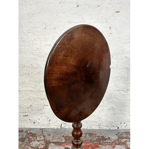 169 - A Georgian mahogany tilt top circular occasional table on tripod pedestal support