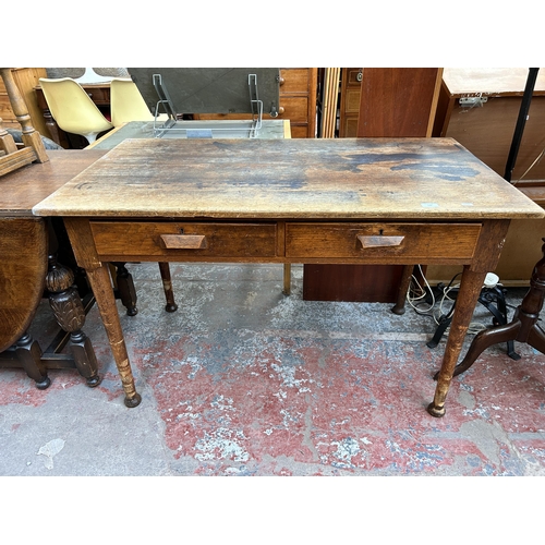 170 - A mid 20th century oak office desk with two drawers