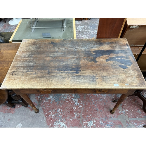 170 - A mid 20th century oak office desk with two drawers