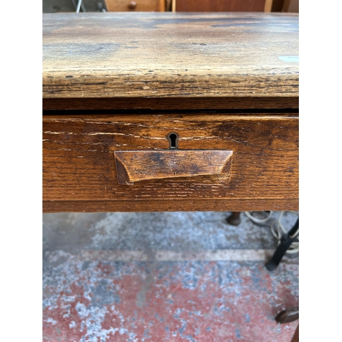 170 - A mid 20th century oak office desk with two drawers