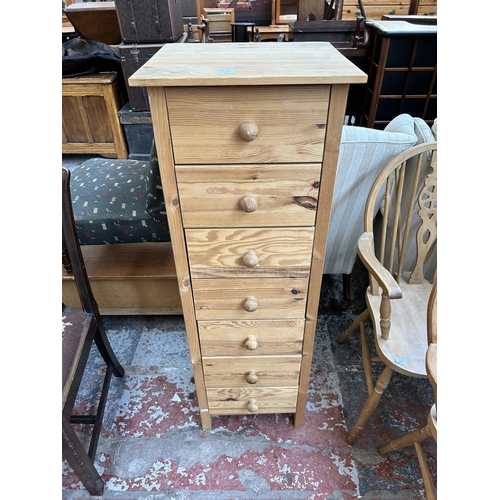 176 - A pine chest of seven drawers