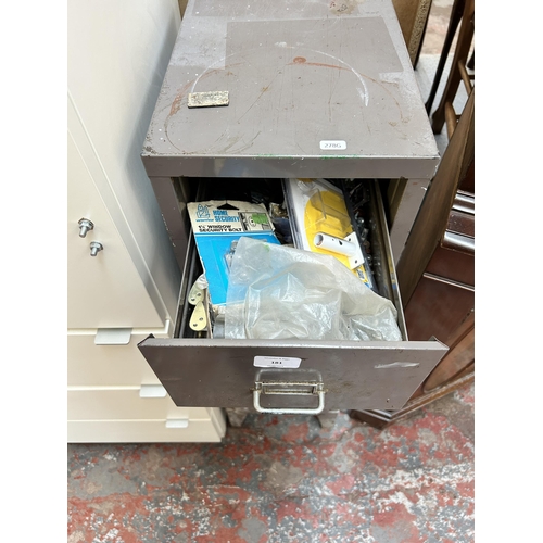 181 - A Stor grey metal five drawer filing cabinet with contents