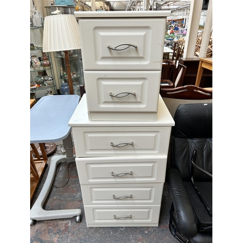183 - A modern white laminate two piece bedroom suite comprising bedside chest of two drawers and chest of... 