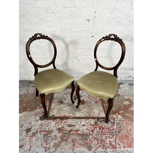 186 - A pair of Victorian carved mahogany and green fabric upholstered dining chairs