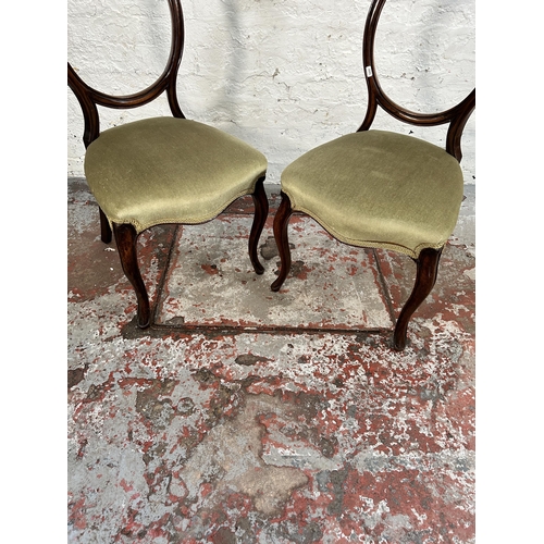 186 - A pair of Victorian carved mahogany and green fabric upholstered dining chairs