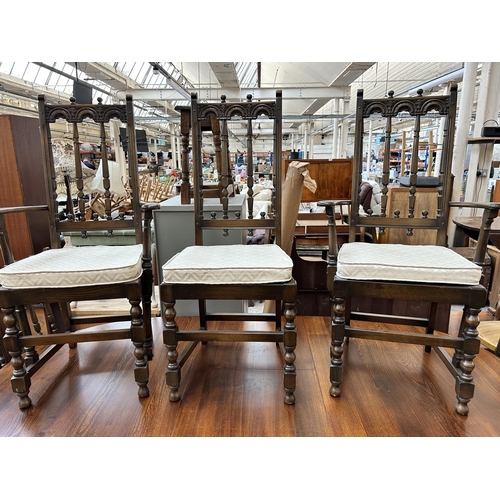 190 - An Ercol Old Colonial elm extending dining table and six Ercol Old Colonial Yorkshire dining chairs