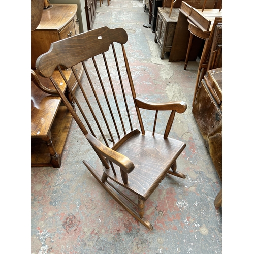 199 - A beech spindle back rocking chair
