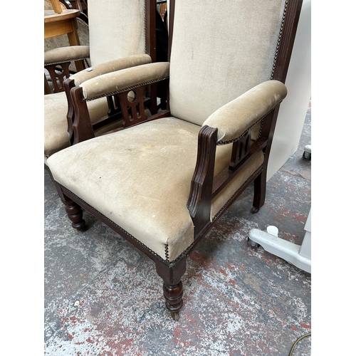 209 - A pair of Edwardian mahogany and fabric upholstered armchairs