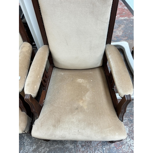 209 - A pair of Edwardian mahogany and fabric upholstered armchairs