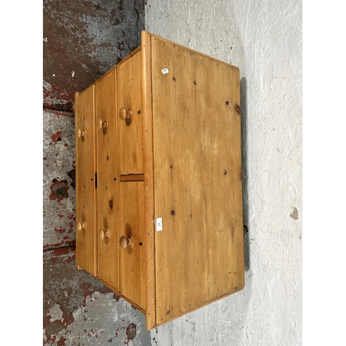 214 - A Victorian pine chest of two short over two long drawers with turned supports